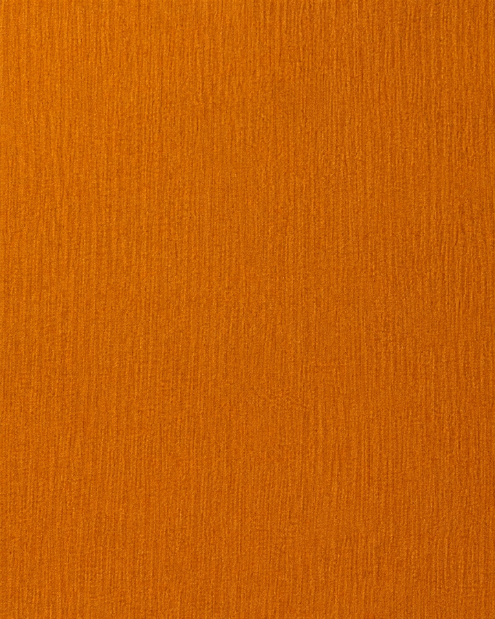 Närbild av enfärgad design utan synliga ränder på CUPRUM, bröstnäsduk i kopparorange